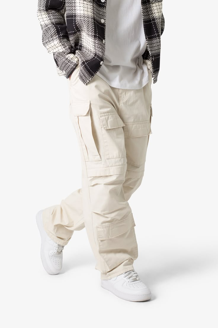 the Ultra Baggy Cargo Pants are designed with a new oversized ultra baggy fit, constructed from a ripstop fabric with a rinse wash, featuring cargo pockets throughout with snap closures, and finished with a button placket. details ultra baggy fit throughout 100% cotton extended inseam model is 6’1, 140 lbs and wears a size 30 Mens White Cargo Pants Outfit, White Denim Men Outfits, Gender Neutral Streetwear, Mens Streetwear Pants, Gen Z Streetwear, Bold Mens Fashion, Men’s Cargo Pants Styles, Cargo Baggy Pants Outfit, Off White Cargo Pants Outfit