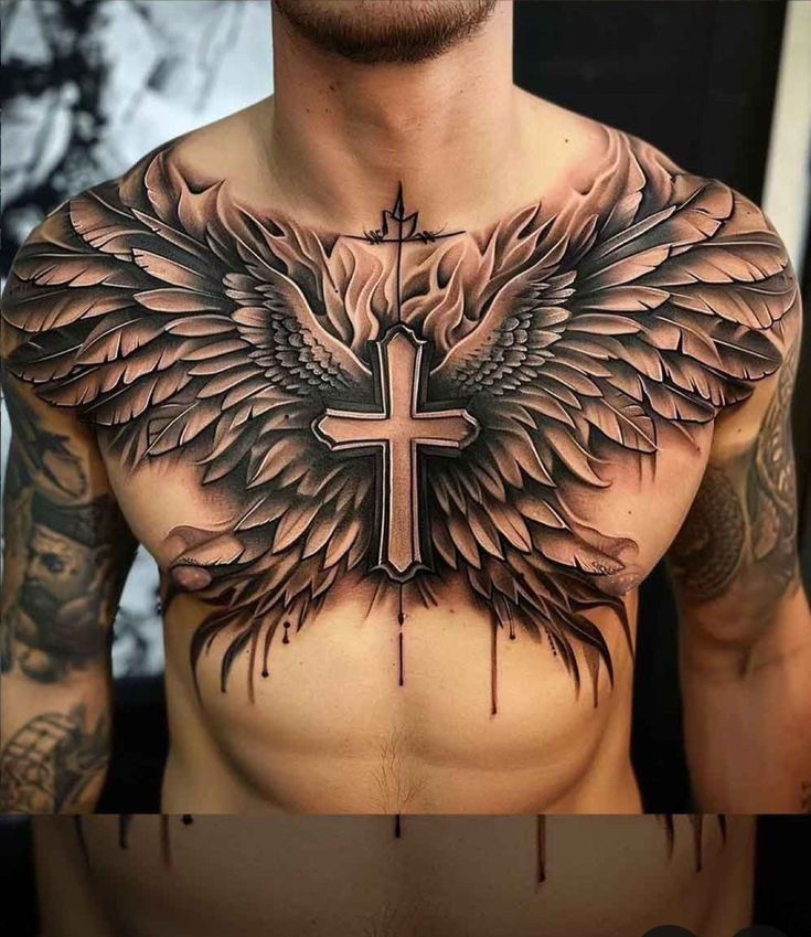 a man's chest with wings and a cross tattoo on the top of it