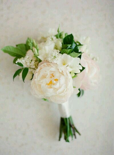 a bridal bouquet with white and pink flowers