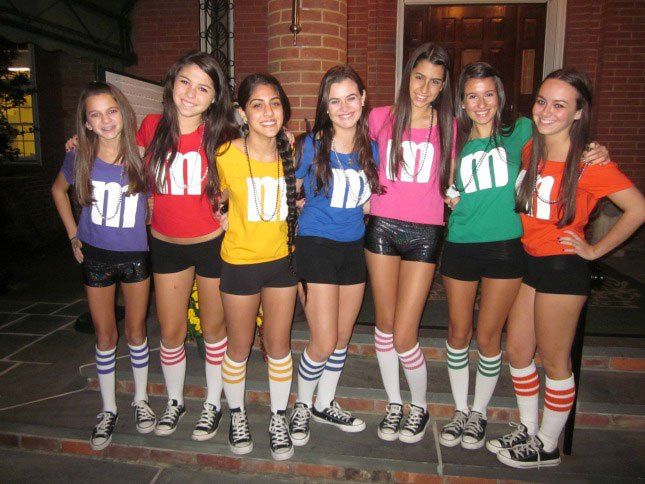 a group of young women standing next to each other