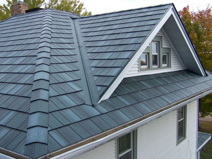 a house with a metal roof in the fall