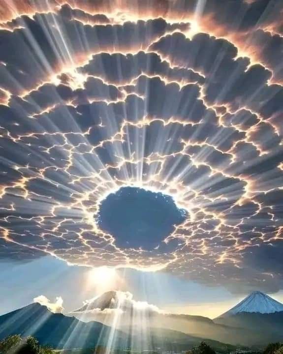 the sky is filled with clouds and sun rays