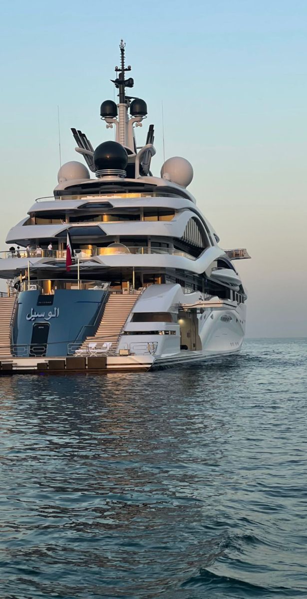 a large white boat floating on top of the ocean