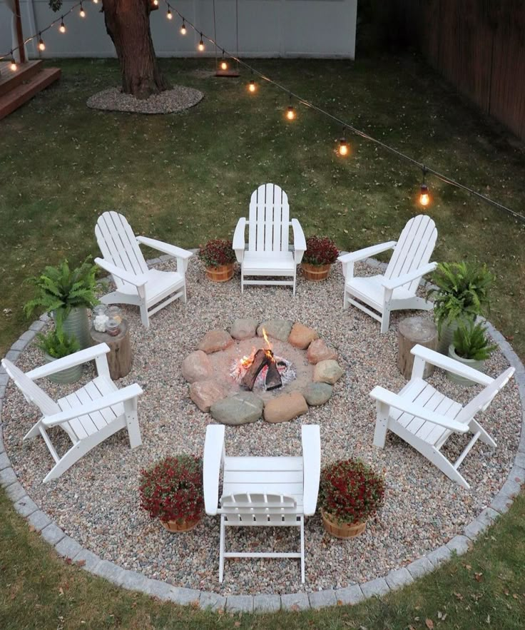 a fire pit with chairs around it