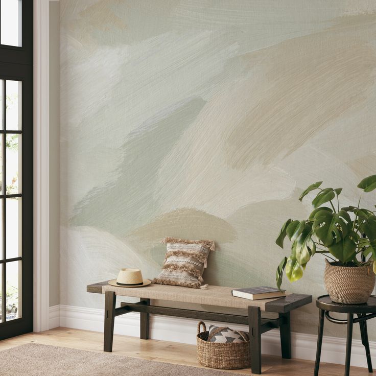 a living room with a bench and potted plant