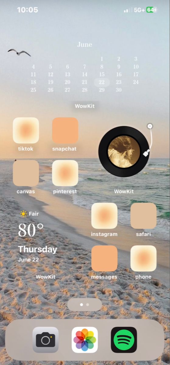 an iphone screen with the calendar on it and beach scene in the backgroud