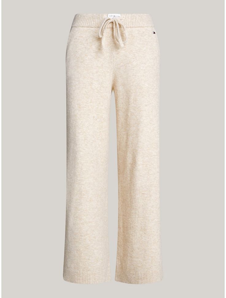 Tommy Hilfiger women's sleepwear. Nothing is better than lounging around in a pair of cozy, loose-fitting sweats—well, these were designed for just that. Made from a blend of nylon, acrylic and wool, woven in a jersey knit for a soft, subtle texture, our wide-leg lounge pant is made complete with an elastic drawstring waistband, pockets, and rib-knit hems.  Material: 47% Recycled Polyester, 33% Polyamide, 13% Acrylic. Cozy Bottoms For Fall Relaxation, Beige Sweatpants For Loungewear In Fall, Cozy Bottoms For Relaxation In Fall, Beige Sweatpants For Fall Loungewear, Cozy Winter Pants For Relaxation, Beige Lounge Pants For Winter, Beige Pants For Winter Loungewear, Cozy Fall Bottoms For Relaxation, Beige Pants For Lounging In Fall