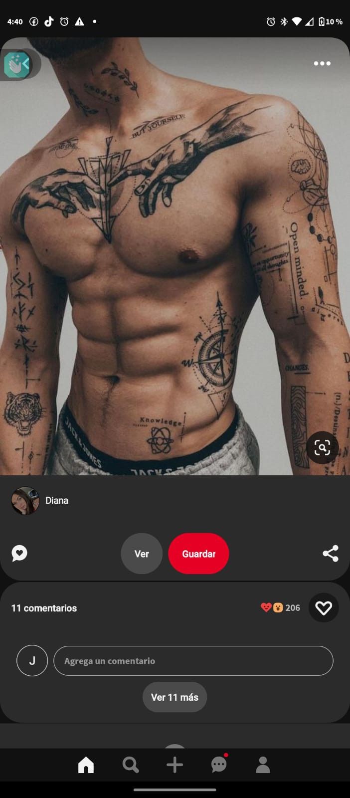 an image of a man with tattoos on his chest