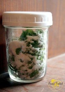 a glass jar filled with green and white stuff