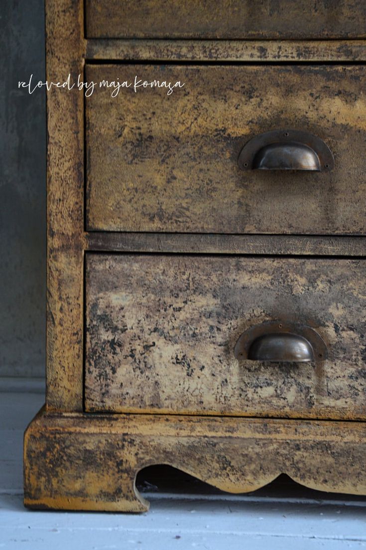 an old wooden dresser with metal handles and knobs on it's drawers is shown