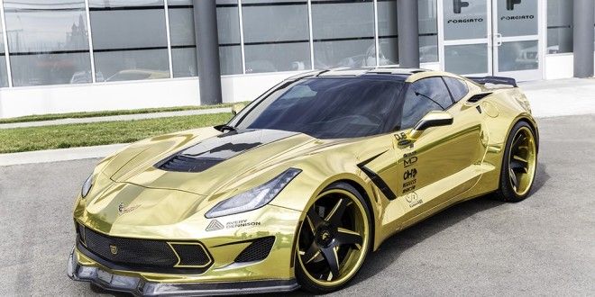 a yellow sports car parked in front of a building