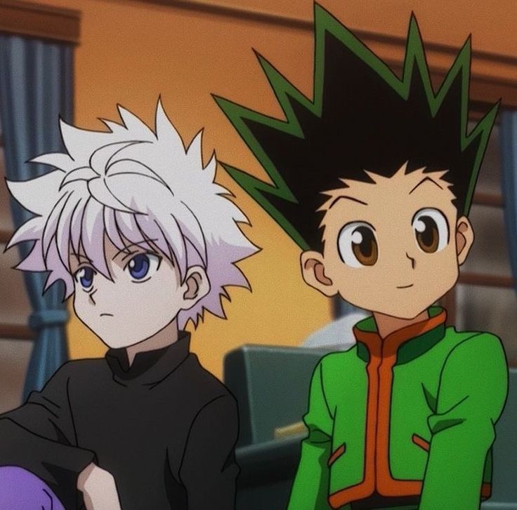 two anime characters sitting next to each other