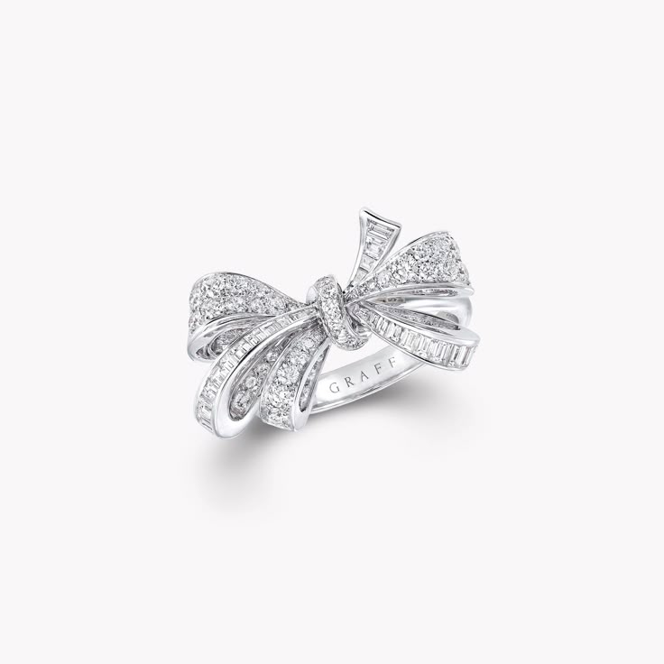 Discover the diamond bow ring depicting a lively bow motif from the Bow jewellery collection at Graff. Enter a world of perfection and beauty. Luxury Silver Jewelry With Bow, Luxury Silver Jewelry With Bow Detail, Diamond Bow Jewelry For Weddings, Luxury Bow Jewelry For Anniversary, Elegant Diamond Rings With Bow Detail, White Gold Bow Rings For Wedding, Elegant Diamond Jewelry With Bow Detail, Luxury Diamond Bow Jewelry, Diamond Ring With Bow For Gift