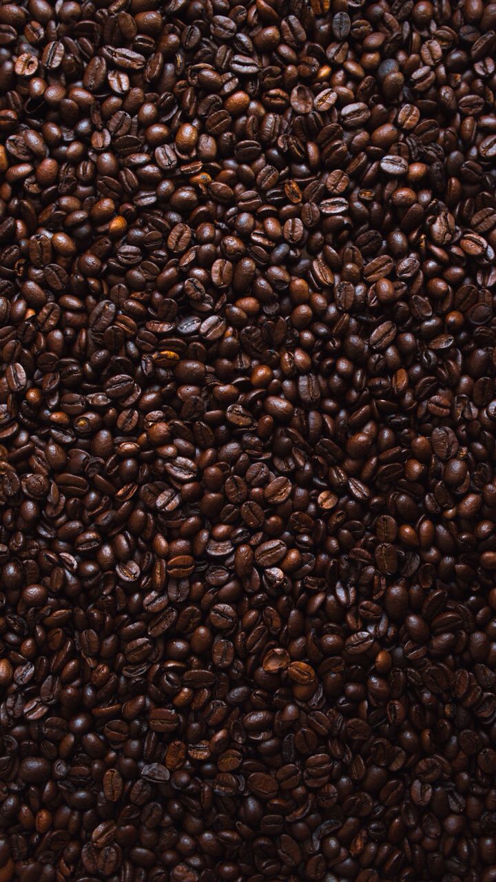 a pile of coffee beans sitting on top of each other