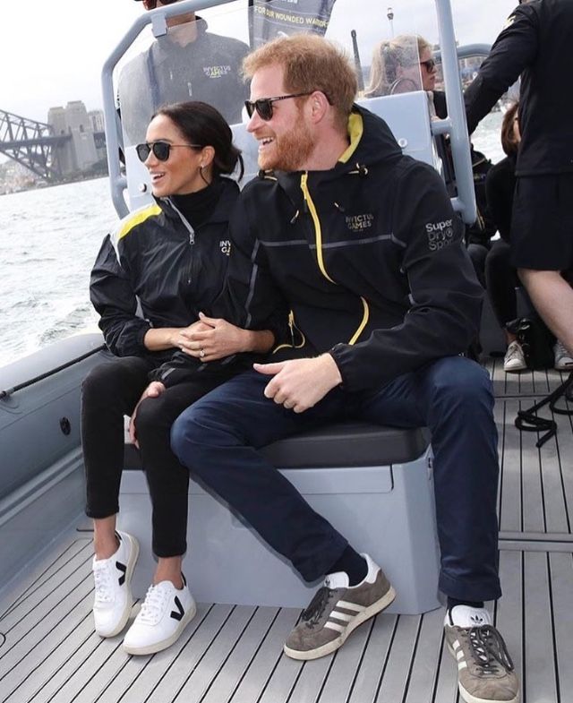 two people sitting on a boat in the water