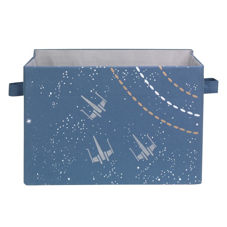 a blue box with airplanes flying in the sky and stars on it's side