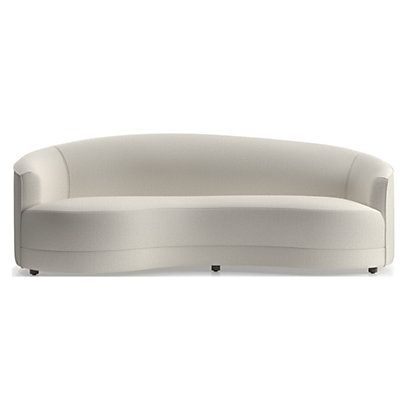 the curved couch is white and has black legs