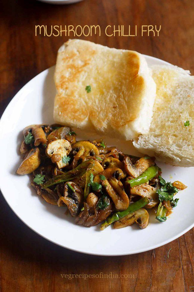 mushroom chilli fry on a plate with bread