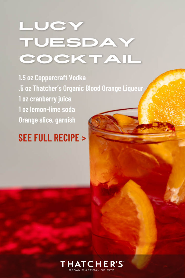 a cocktail with orange slices on the side and text that reads, juicy tuesday cocktail