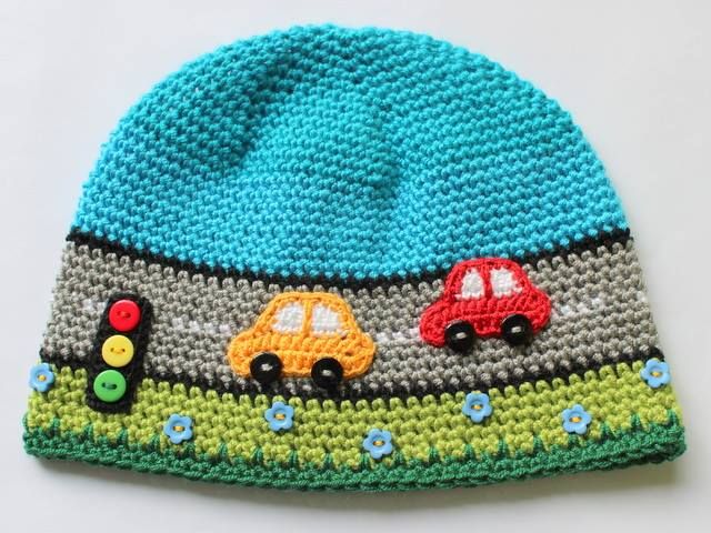 a crocheted hat with cars on it