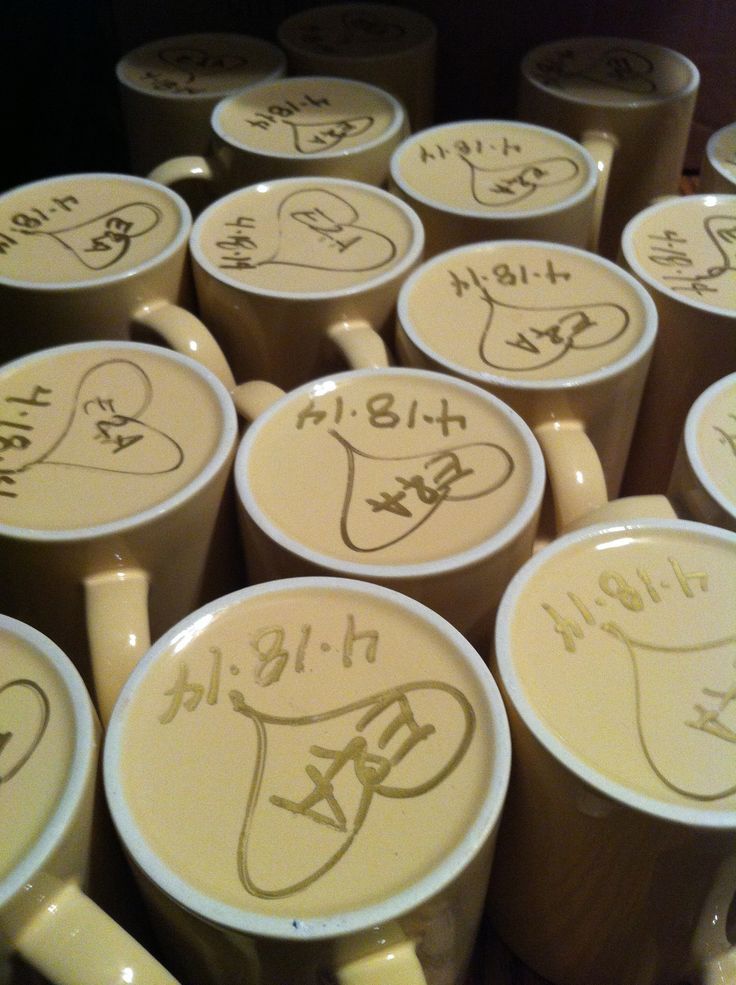 many coffee cups with writing on them