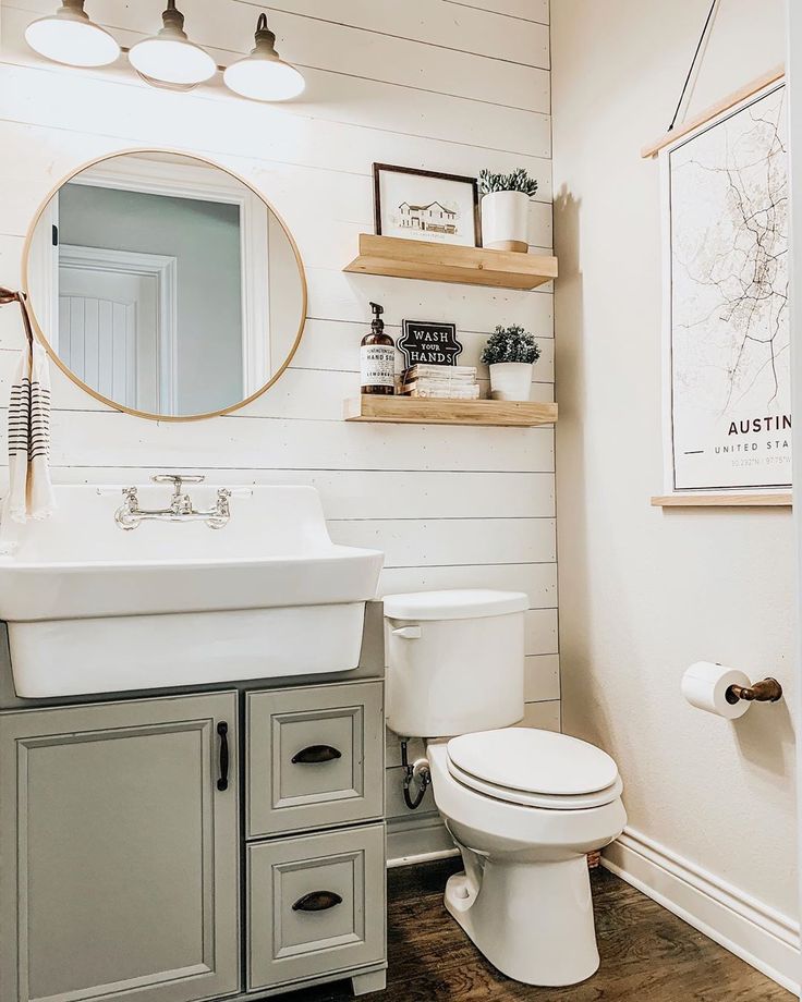 the bathroom is decorated in white and gray