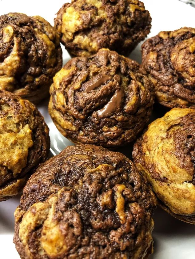 several chocolate muffins on a plate ready to be eaten