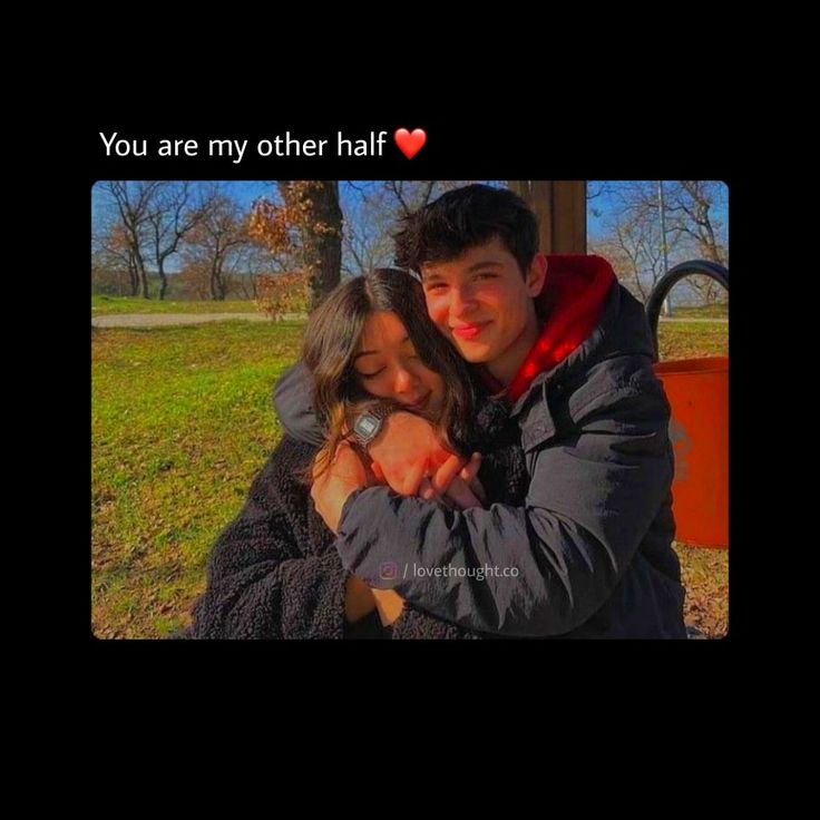 a man and woman hugging each other in front of a park bench with the caption you are my other half