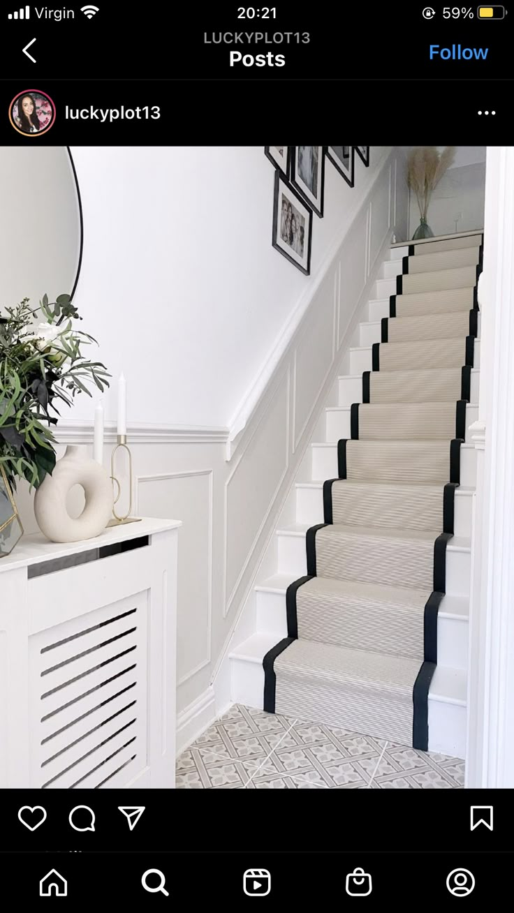 the stairs in this house are painted white and have black trimmings on them