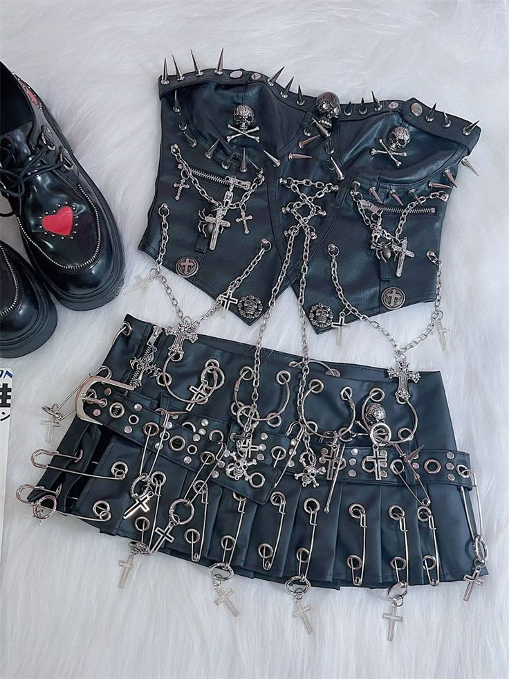 This pleated short skirt is made of PU material and features numerous metal details for decoration, giving it a stylish and unique design. The skirt comes with a matching belt for added flair.  The price includes both the skirt and the belt.   	 		 			Size 			S 			M 			L 		 		 			Waist 			70 			74 			78 		 		 			Hips 			90 			94 			98 		 		 			Length 			21 			22 			23 Cheap Punk Crop Top For Club, Cheap Punk Style Crop Top For Club, Punk Style Crop Top For Streetwear, Rave Wear Skirts, Spikes Skirt Set, Space Cowgirl Skirt, Y2k Punk Elements Fabric, Jewled Skirt, Techno Punk Fashion