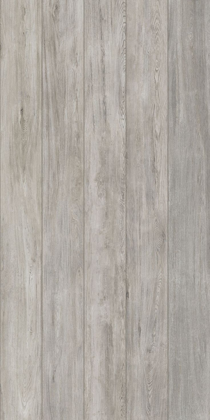 a wood paneled wall with grey paint