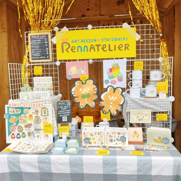 a table topped with lots of cards and paper goods next to a sign that says rematifier