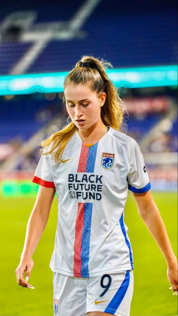 a female soccer player in action on the field