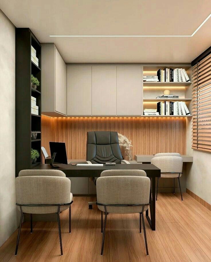 an office with wooden floors and built in bookshelves on the wall is shown