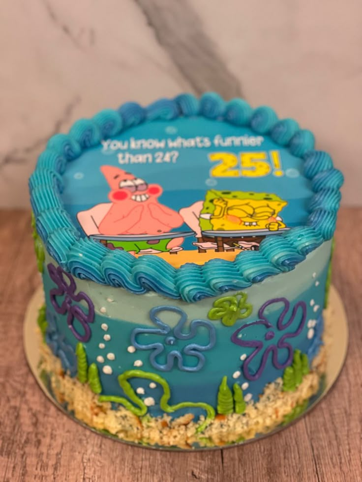 a spongebob themed birthday cake on a wooden table