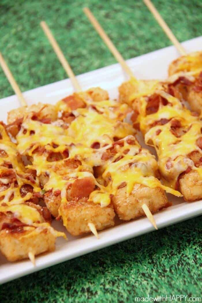 small appetizers on skewers with cheese and bacon are ready to be eaten