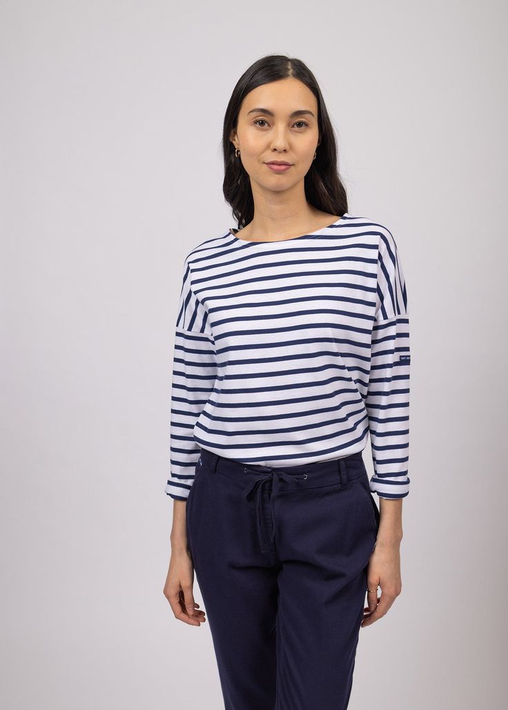 Elevate your French-girl game with this latest addition to our authentic Breton shirt collection! Tailored from our all-time best-seller shirt, MINQUIERS MODERNE, the MINQUIERS DROP features a more relaxed silouhette with dropped shoulders while maintaining the boyfriend fit and comfortable cotton we love. Made in Saint-James, Normandy, France. 100% lightweight cotton jersey. Breton Stripe Shirt, Breton Shirt, Nautical Shirt, French Wardrobe, Sailor Shirt, Normandy France, Fisherman Sweater, Saint James, French Linen