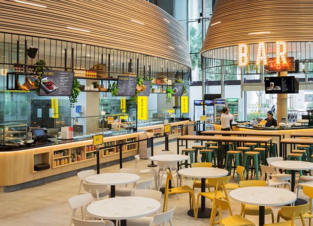 the inside of a restaurant with tables and chairs