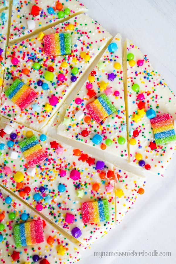 white cake with sprinkles and rainbow candies