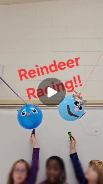 children holding up balloons with the words reindeer racing on them