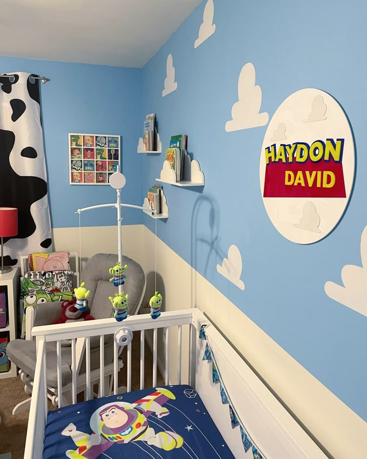 a child's bedroom with a toy bed and toys on the wall