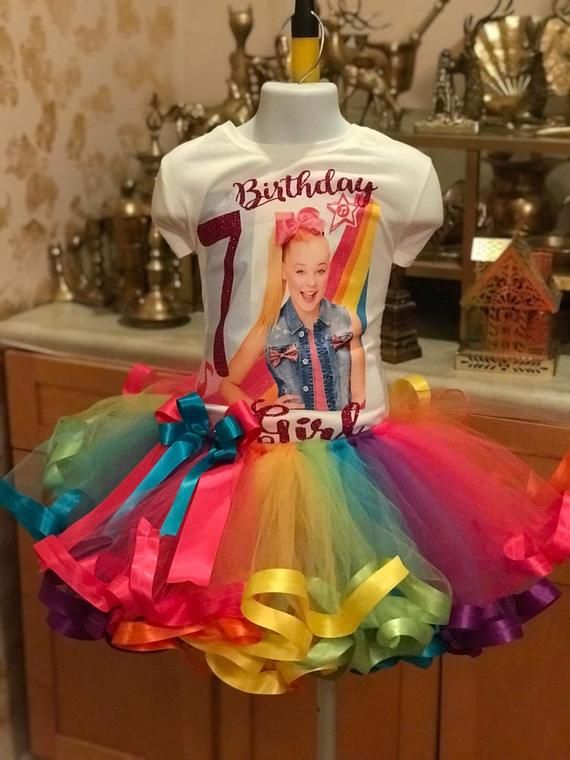 a birthday t - shirt with a rainbow tutu skirt on display in a kitchen