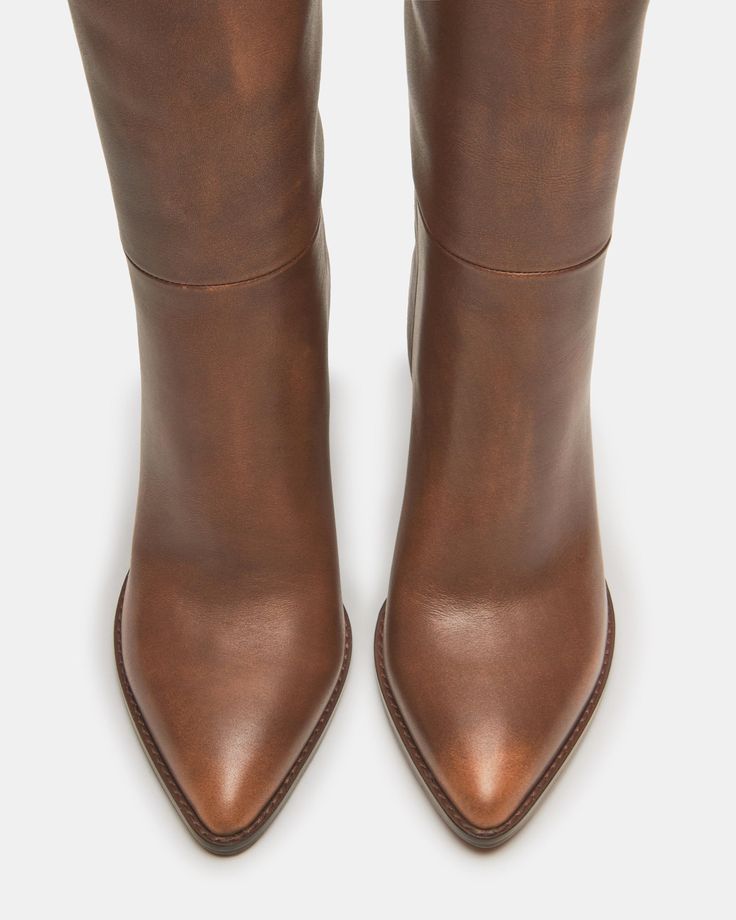 A pointed toe and curved topline give the BIXBY block heel knee boot a Western edge while the sleek upper highlights the clean look Point toe block heel knee boot Slip-on style Curved topline 3.5 inch heel height Size 6 measurements: 15.5 inch shaft circumference, 14.25 inch shaft height Size 8 measurements: 16 inch shaft circumference, 15 inch shaft height Size 10 measurements: 17 inch shaft circumference, 15.5 inch shaft height Leather upper material Synthetic and textile lining Synthetic sock Knee Boot, Jewelry Outfit, 5 Inch Heels, Brown Leather Boots, Crazy Shoes, Tall Boots, Brown Boots, Fun Bags, Western Boots