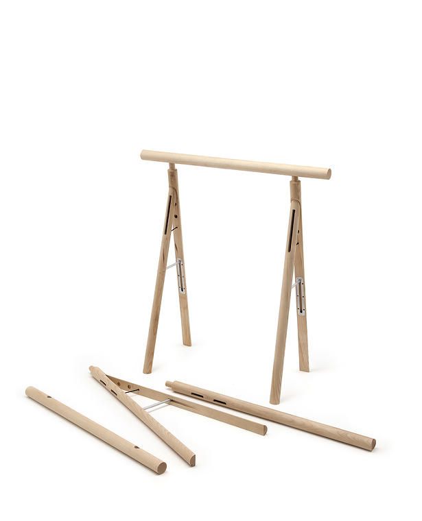 a wooden swing set with four pieces of wood on the bottom and one piece missing