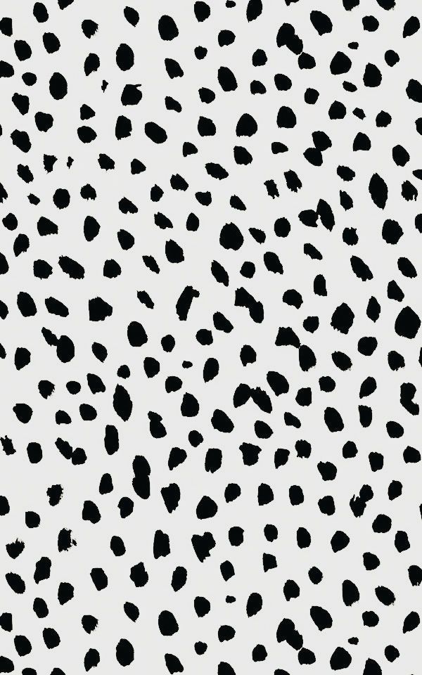 black and white animal print pattern on a white background, with spots in the middle