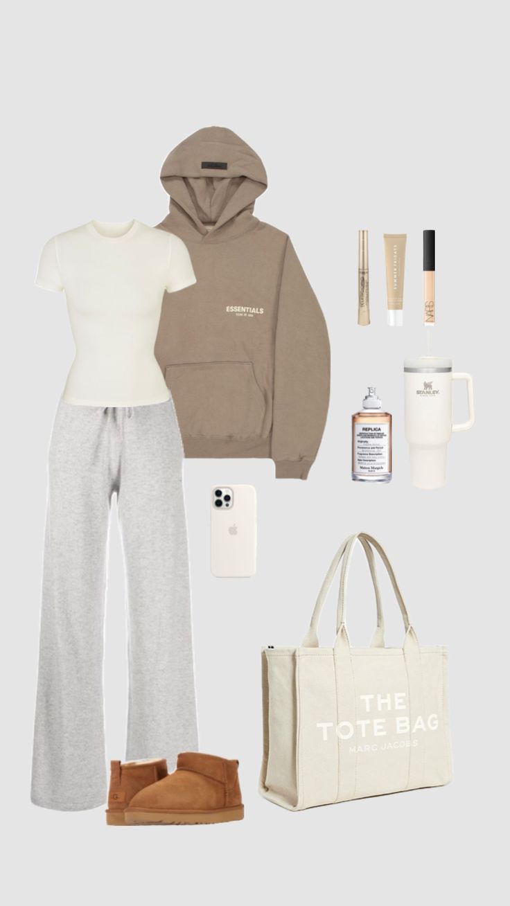 the contents of a woman's outfit including a tote bag, sweater and boots