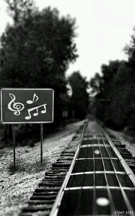 a black and white photo with a guitar in the foreground that says, en veradas, no fuera por la musicala, habia mas radones para vol