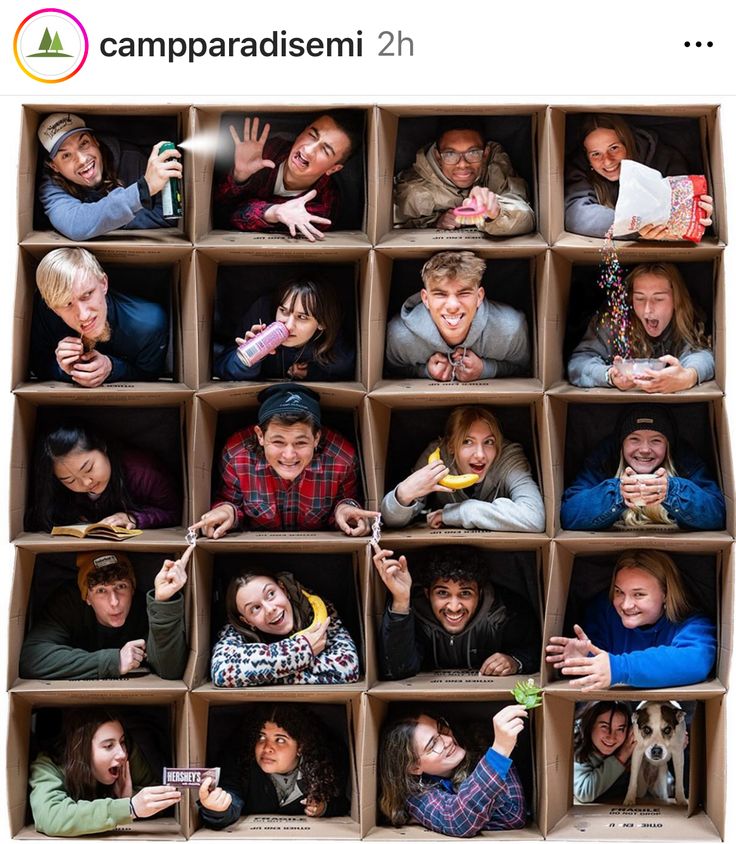 a group of people in a cardboard box with their mouths open and hands up to the camera