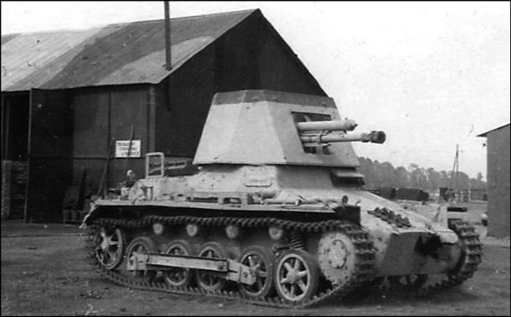 an old tank sitting in front of a building