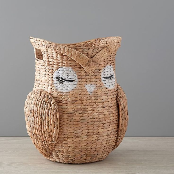 an owl shaped basket sitting on top of a table